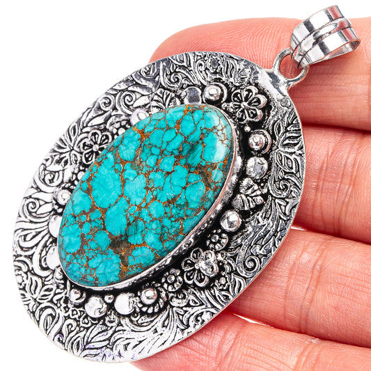 German silver turquoise oval pendant with ornate filigree and loop bail