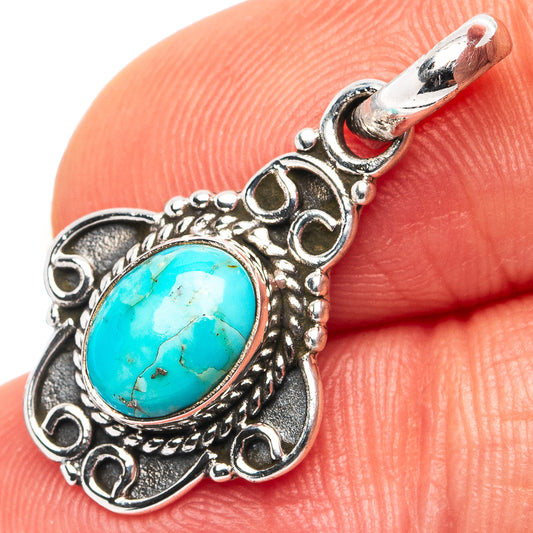 Turquoise oval pendant in .925 sterling silver, ornate filigree with round bail