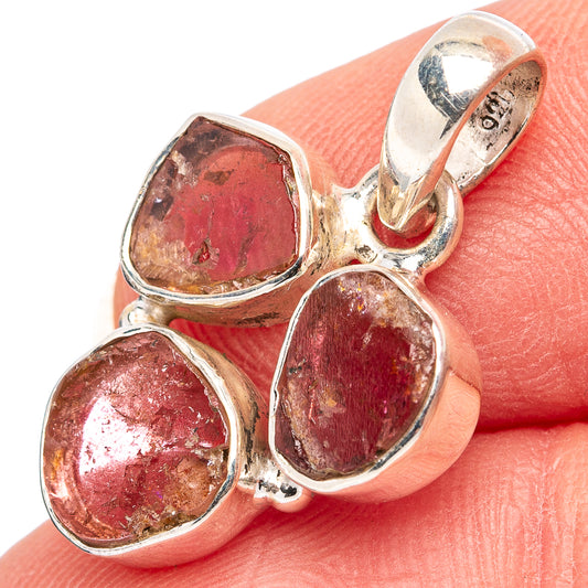 Sterling silver tourmaline pendant with three faceted red-pink gemstone bezels