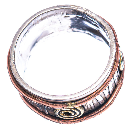 Meditation spinner ring underside with textured silver band and gold spiral emblem