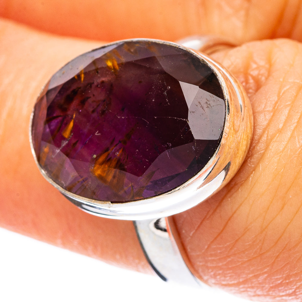 Oval amethyst-purple gemstone silver ring with faceted shine