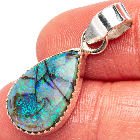 Sterling silver teardrop opal pendant with blue-green iridescent stone in bezel