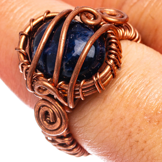 Oxidized copper wire-wrap ring with dark blue sodalite cabochon center