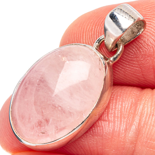 Oval rose quartz pendant with .925 sterling silver setting and bail, pink gemstone close-up