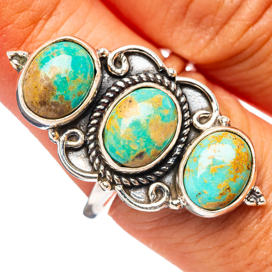 Adjustable sterling silver ring with three oval turquoise cabochons in ornate settings