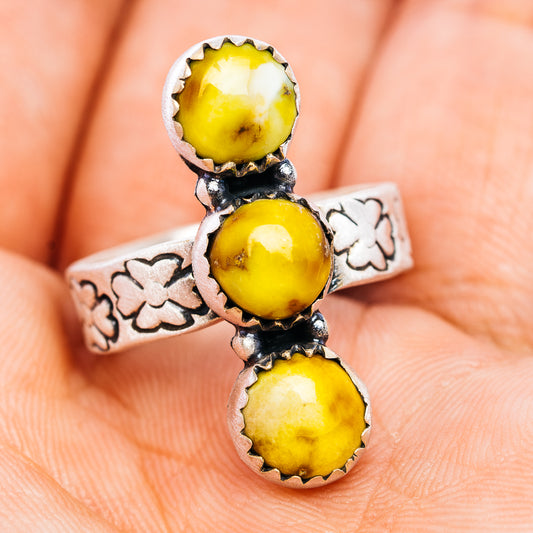 Sterling silver ring with three round yellow cabochon stones and etched clover band