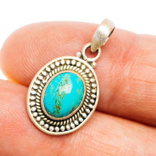 Sterling silver turquoise oval pendant with beaded round bezel and bail