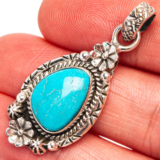 Sterling silver turquoise pendant with oval Sleeping Beauty cabochon and ornate floral bezel