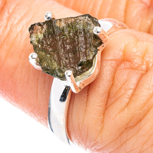 Moldavite ring in sterling silver with green rough stone and four prong setting