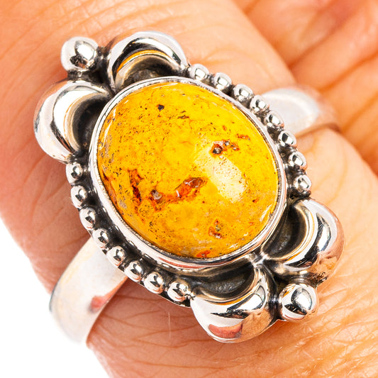 Sterling silver ring with oval amber jasper center and beaded silver halo