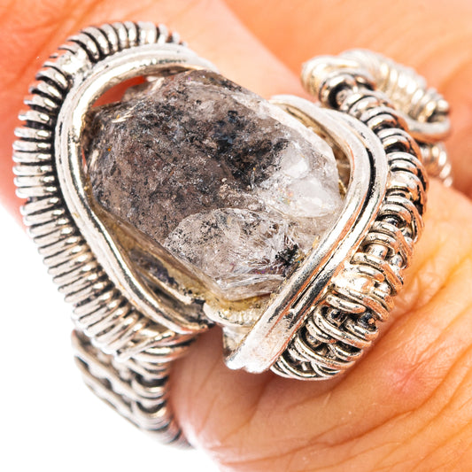 925 sterling silver wirework teardrop ring on finger with braided band