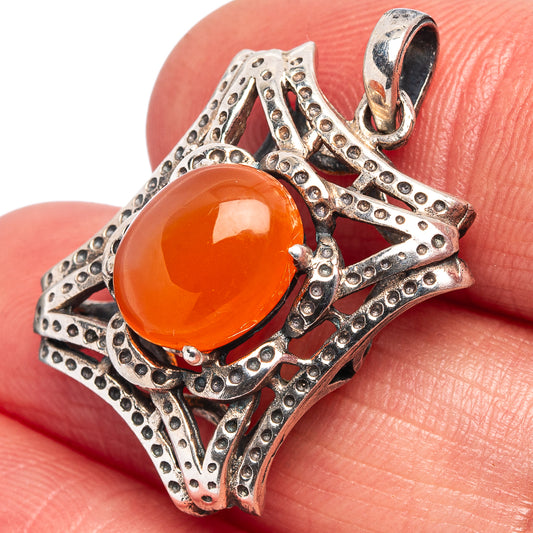 Carnelian cabochon pendant in .925 sterling silver, ornate openwork with loop bail