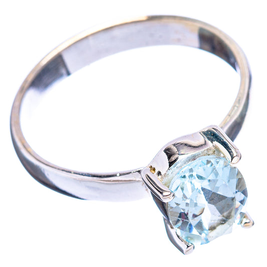 Sterling silver band with light blue round topaz gemstone in prong-set setting