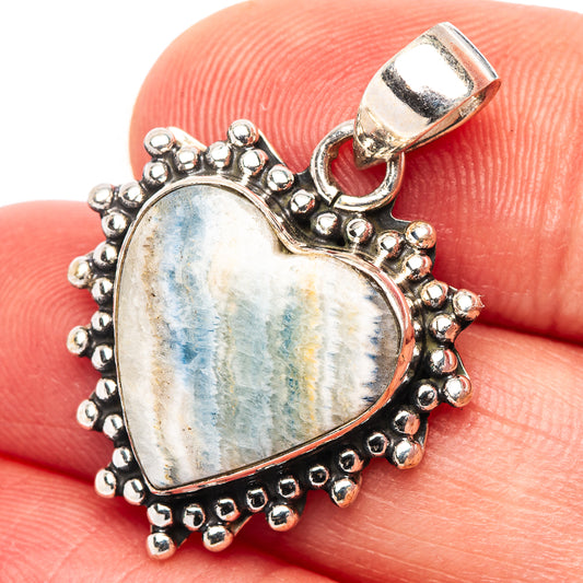 Heart scheelite pendant with blue mottled stone in beaded sterling silver frame