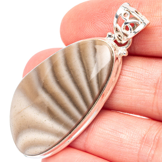 Oval flint pendant with striped stone in .925 sterling silver setting