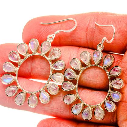 Sterling silver hoop earrings with pear-shaped rainbow moonstone drops, openwork halo