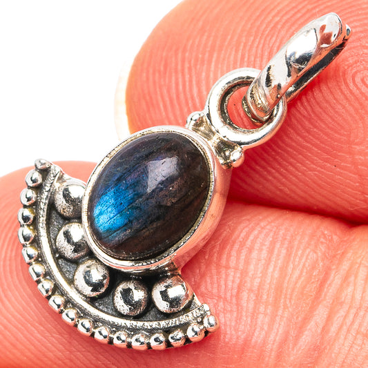Oval labradorite pendant in .925 sterling silver with ornate bezel and blue shimmer