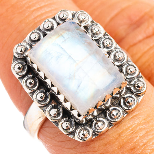 Sterling silver moonstone ring with round stud bezel and iridescent light-blue rectangular stone