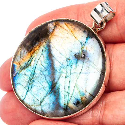 Round labradorite pendant with blue-green flash in sterling silver bezel