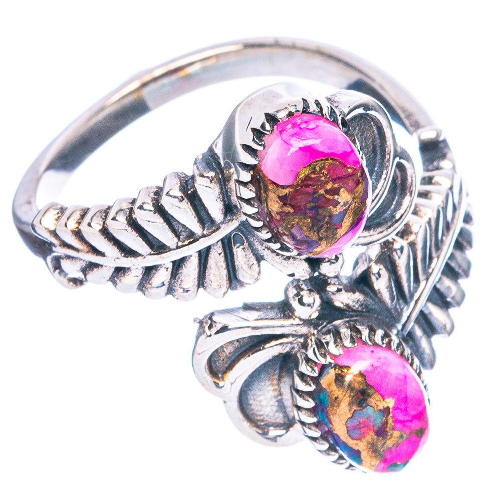 Sterling silver ring with ornate band and pink oval gemstone cabochon with blue matrix