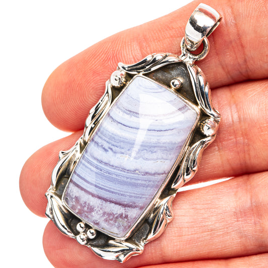 Sterling silver lace agate pendant with blue striped oval stone and loop bail