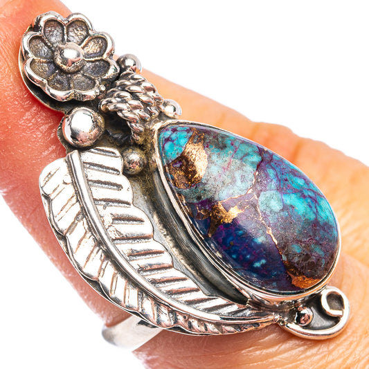 Sterling silver ring with oval blue-green turquoise stone and leaf-like top detail