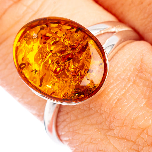 Oval amber ring with warm Baltic amber cabochon set in 925 sterling silver