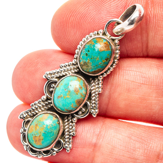 Turquoise oval pendant with three settings in .925 sterling silver, close-up front