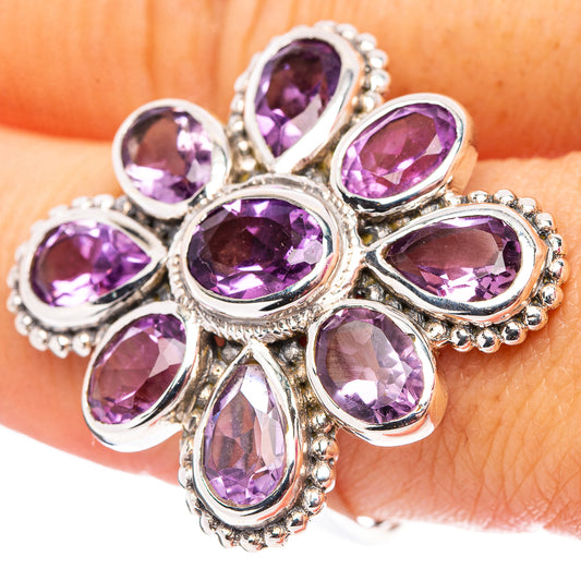 Amethyst flower ring with oval purple gemstones on .925 sterling silver band.
