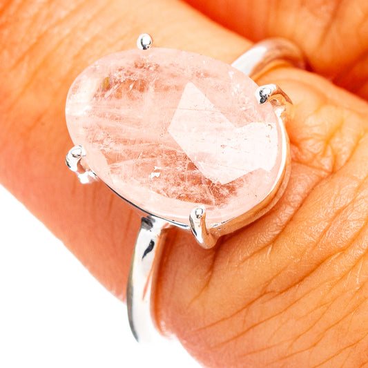 Sterling silver morganite ring on hand, oval faceted pink stone in prong setting