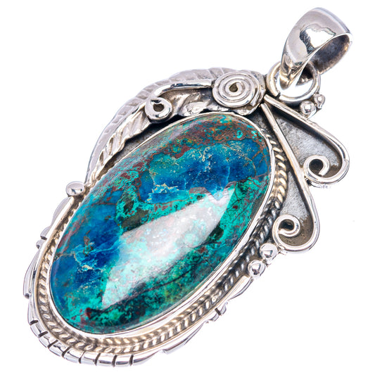 Sterling silver oval pendant with blue-green stone, ornate frame, and bail