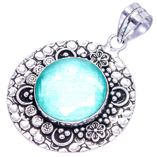 Round green agate pendant with textured German silver filigree border and loop bail.