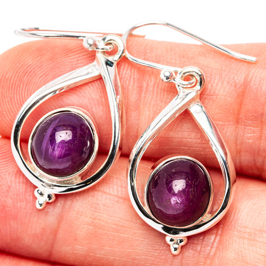 Teardrop star ruby earrings in .925 sterling silver with purple cabochon stones