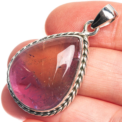 Sterling silver teardrop pendant with deep purple gemstone