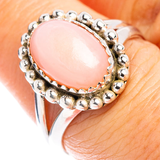 Sterling silver ring with bead border around pink oval opal cabochon