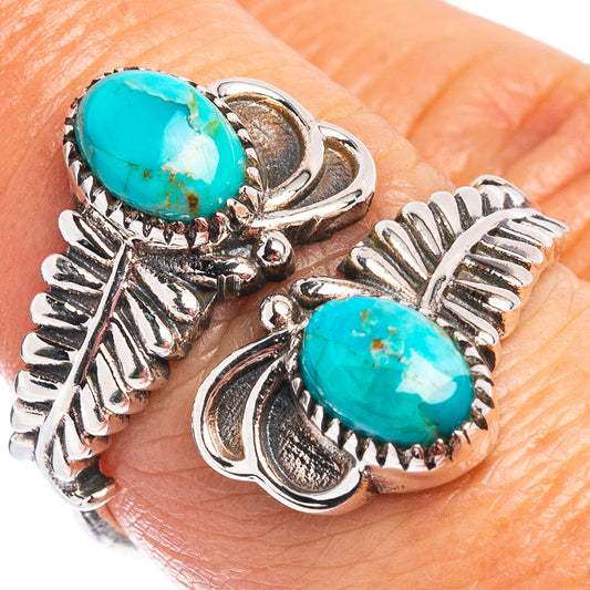 Adjustable sterling silver turquoise ring with two oval cabochon stones and ornate leaf details