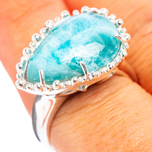 Sterling silver larimar cabochon oval ring with scalloped bezel and prong details