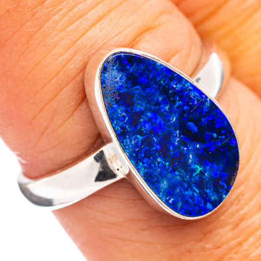 Sterling silver ring with blue oval opal gemstone in bezel setting