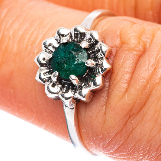 Sterling silver ring with oval green gemstone and ornate prong halo