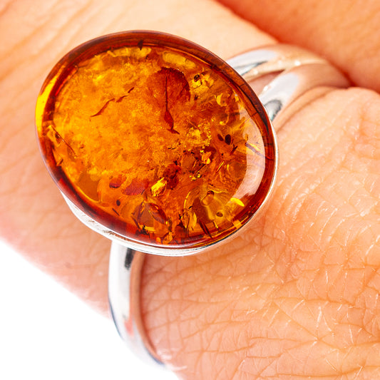Amber cabochon ring with oval Baltic amber set in .925 sterling silver band