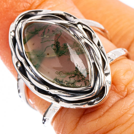 Sterling silver moss agate oval ring with dark green veined stone and swirl setting