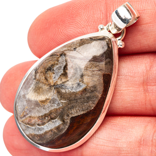 Teardrop rhyolite pendant in .925 sterling silver with mottled mushroom-like stone pattern