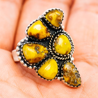 Sterling silver adjustable ring with yellow oval and teardrop stones, beaded border