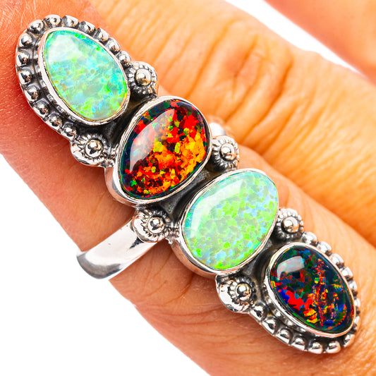 Sterling silver opal-look ring with four oval stones in green, red, and blue.