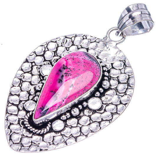 Pink teardrop opal pendant with textured German silver setting and metal bail loop