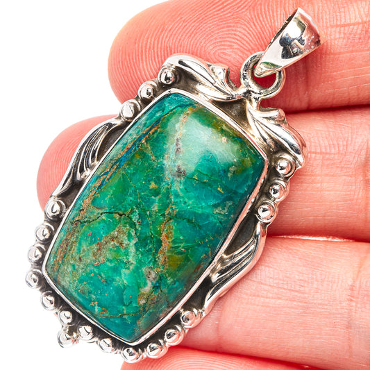 Sterling silver chrysocolla pendant with rectangular green gemstone, ornate bezel