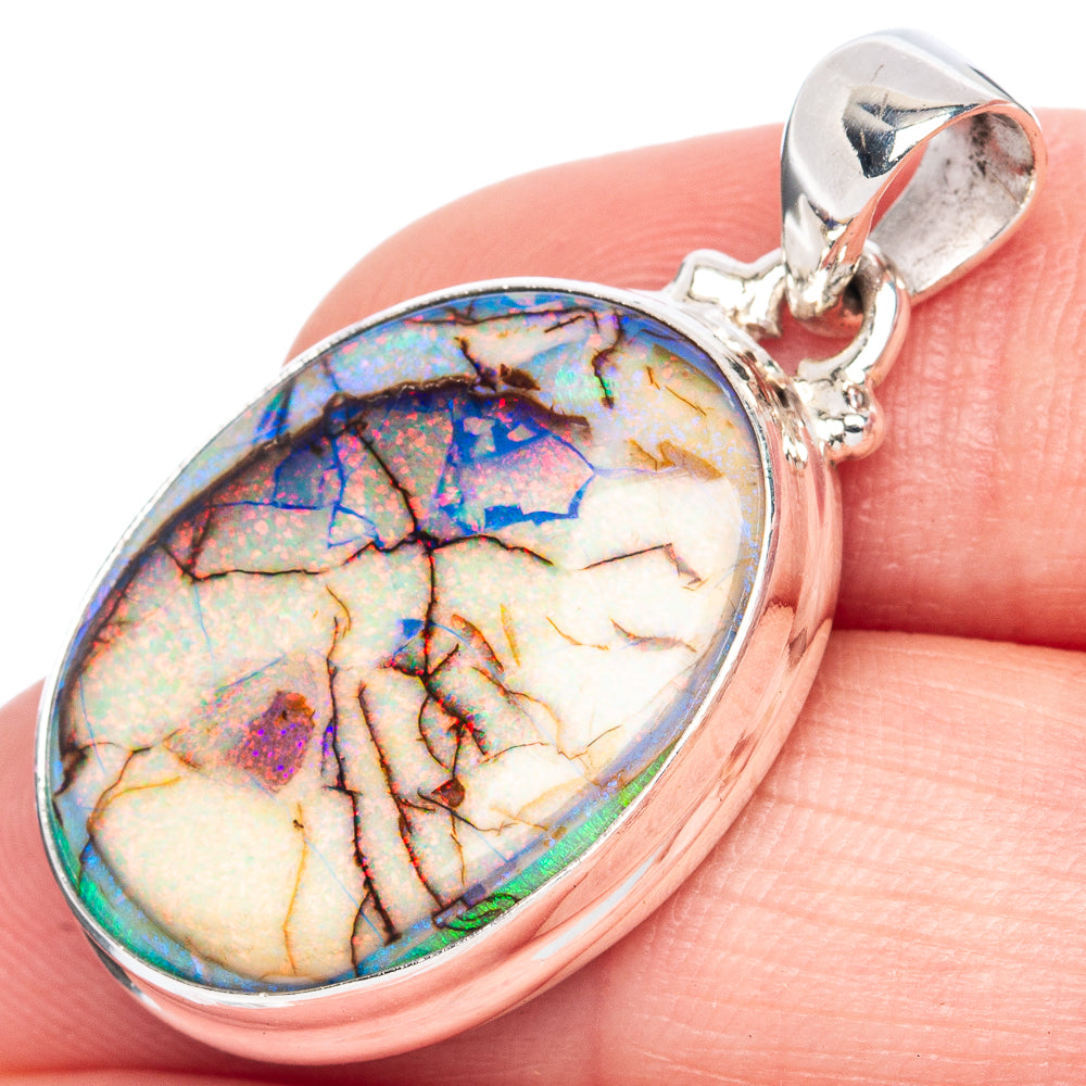 Sterling silver oval opal pendant with iridescent multi-color stone and polished bail
