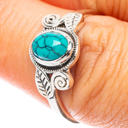 Sterling silver ring with oval turquoise cabochon and leaf filigree detail