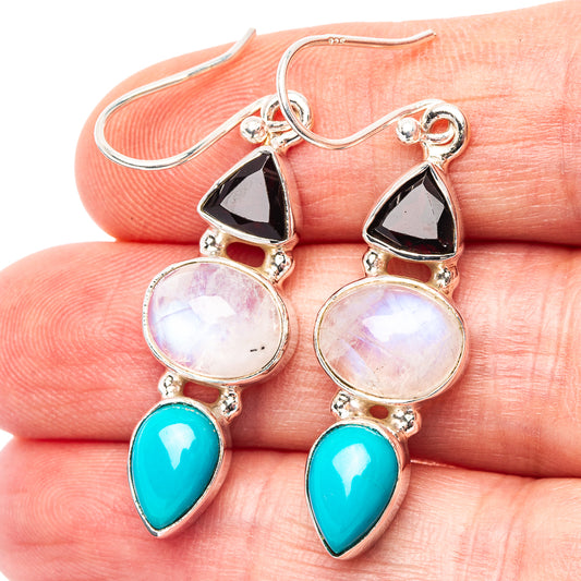 Sterling silver drop earrings: black triangular accents, opalescent stones, turquoise pear charms