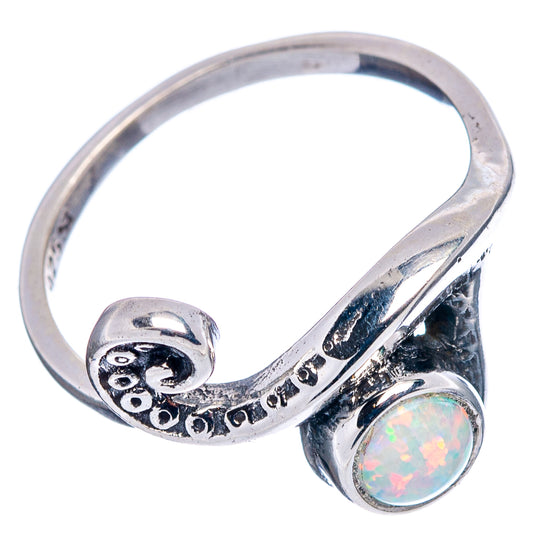 Sterling silver opal ring with curved wave band and round opal cabochon, side view